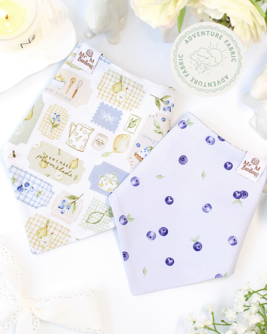 dog bandanas with patterns on a white surface with flowers.