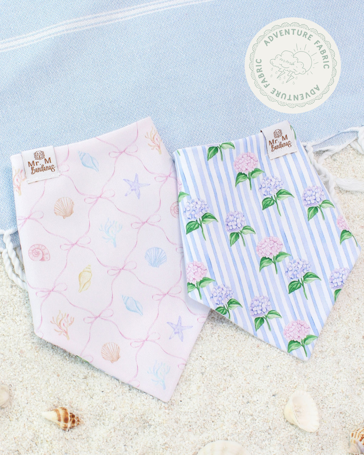 Two dog bandanas on a sandy background.
